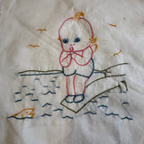 Vintage embroidered Kewpie Doll quilt blocks
